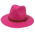 Detail of rose red woven Panama hat featuring a brown leather band and small fringe tassel - Rose Red