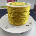Close-up of golden metallic craft cord on a spool for DIY jewelry braiding - Golden Yellow With Gold Thread (540)