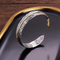 Vintage adjustable alloy feather cuff bracelet in silver with gold accent and S925 engraving - Silver and Gold
