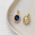 Detailed macro view of an 18k gold-plated oval zircon pendant with white pearls - 10# 18K Gold Pearl Deep Blue Zirconia