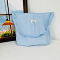 Detailed close-up of blue and white striped fabric tote bag on a minimalist desk - Blue Stripe