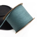 Detailed view of 1.5mm teal woven cotton cord wound on a brown paper spool for DIY crafts - Approx. 1.5MM / Cyan