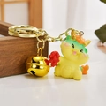 Cute yellow cartoon dragon keychain with large golden bell and metallic ring - Firecracker Dragon Style