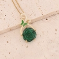 Gold stainless steel necklace with green rose pendant and butterfly accent on stone - Green