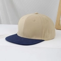 Detail of a two-tone khaki and navy blue hip-hop flat brim baseball cap for kids - 54cm (3-8 Years) / Light Khaki
