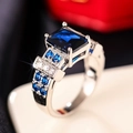 Macro shot of rectangular blue gemstone ring with intricate diamond pave settings - US 6 / Dark Blue