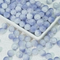 Macro shot of 10mm light purple and white marbled glass beads for DIY jewelry making - Mist Blue (10mm Jade Fragment)