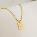 Detailed close-up of 18K gold plated square pendant featuring engraved letter P - Letter P