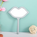 Lip shaped handheld makeup mirror with grey frame and high definition glass surface - Blue