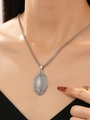 Macro shot of silver american football pendant necklace with sparkling rhinestones - Alloy Pave Rhinestone Rugby Pendant Necklace (X585)