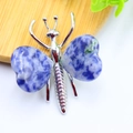 Handcrafted silver butterfly pendant featuring blue heart-shaped natural crystal stones - White K Plated Blue Sodalite