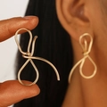 Elegant gold hollow wire-wrapped flower earrings in abstract minimalist metal ribbon style - Abstract Bow Wire Wrapped Earrings / Gold (Bow DZ-435-24)