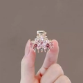 Mini gold hair claw clip with pink crystal flower rhinestones held in hand - 5# Flower Butterfly Claw (Approx. 2.6CM)