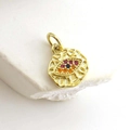 Macro shot of gold star-shaped evil eye pendant with colorful zircon stones inlay - Evil Eye Style 3