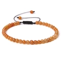 Adjustable 4mm orange gemstone bead bracelet with black braided rope for yoga and wellness - Yellow Aventurine
