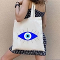 Canvas tote bag with blue Greek Evil Eye graffiti print on a white shoulder shopper - STD1804-M Giant Radiant Blue Eye