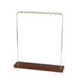 Golden metal necklace display stand with multi-hook design and dark wood base - Gold