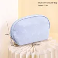 Light blue semi-circular cosmetic bag with floral relief texture and waterproof PU material - Blue Semicircle Bag