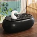 Creative ceramic water fountain featuring a matte black base and white swan neck spout - Flowing Water Wealth - Long White Top Black Bottom