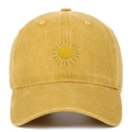 Close-up of yellow sun embroidery on a vintage washed cotton baseball cap texture - Yellow