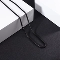 Polished black stainless steel snake bone chain necklace displayed on white geometric blocks - 3.0mm / Black