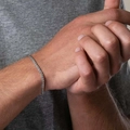 Men's vintage silver stainless steel link bracelet shown on wrist in a stylish fit - Individual Simple Woven Wheat Chain Bracelet / Silver