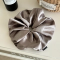 Oversized satin scrunchie in shimmering champagne grey with a small fashion tag - Large 22cm / Champagne