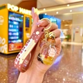 Glow-in-the-dark milk tea cup keychain with pink bear, liquid sand and brown silicone strap - Milk Tea Bear Bottle