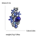 Vintage alloy brooch with blue rhinestones and size measurements 8.0cm by 5.0cm - Blue
