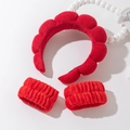 Detail view of red microfiber cloud headband and matching wristbands for skincare - Bright Red Headband And Wristbands Set
