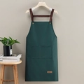 Waterproof green apron with brown neck strap and dual pockets for kitchen cooking - Leather Label Dark Green