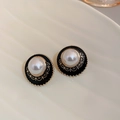 Detail macro shot of vintage black enamel butterfly earrings with a central pearl inlay - 4# Silver Earring Post Black Vintage Pearl Earrings