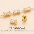 Macro detail of gold bow bead with cubic zirconia stones and exact sizing measurements - TPJ245-White Zircon
