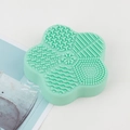 Mint green flower-shaped silicone makeup brush cleaning mat with textured surface - Starfish Dry Cleaning Box / Green