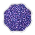 Purple and blue 4mm iridescent glass seed beads in a white petal-shaped container - 4mm / Iridescent Blue Purple (#19 Style)