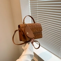 Brown quilted handbag with matching coin purse and golden hardware details - Tan