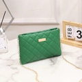 Vibrant green quilted crossbody bag with a gold metal plate and fine chain strap - Green