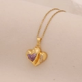 Macro shot of gold heart pendant with purple gemstone and small crystals on O-chain - Purple