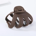 Detail showing matte brown resin hair claw clip with multi-tooth design on white backdrop - Brown