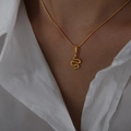 Minimalist gold snake pendant necklace featuring a geometric design and fine snake chain - Snake-40+7cm