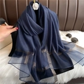 Detail of navy blue scarf with golden metallic threads and soft shimmering texture - Navy Blue