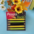 Creative 5-piece ballpoint pen set with funny quotes on a People Suck themed card - People Suck Theme