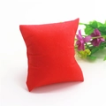Red jewelry display pillow for watch storage and bracelet presentation on white background - Red Non-woven Fabric 7.6x8.5