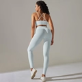 Detail of light blue ribbed yoga set with high waist leggings and criss-cross sports bra - Light Gray