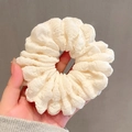 Handheld white oversized scrunchie in seersucker fabric with soft pleated texture - White