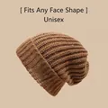Unisex brown ribbed knit beanie hat featuring vertical texture for winter warmth - One Size / Long Label Style / Caramel color