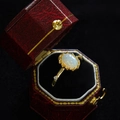 Elegant gold opal ring with side diamonds displayed in a vintage red jewelry box - Gold Oval Opal Vintage Petal Ring