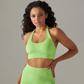 Close-up of lime green seamless sports bra and high-waist ribbed yoga shorts set - M / Tops / Cyan