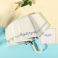 Foldable cream sun umbrella with blue stripes and musical note print and J-hook handle - 3-Fold Manual / J-Handle Notes White