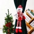 Detail view of knitted snowman curtain buckle with long legs on green drapes - Snowman
